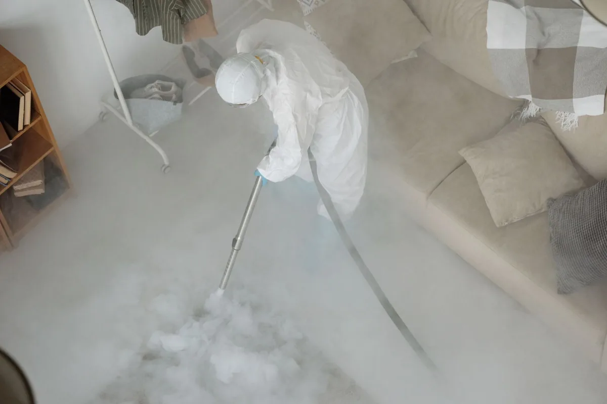Biohazard cleanup technician in protective equipment, Crocker Amazon, San Francisco, CA